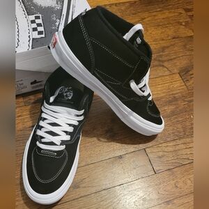 Vans Black and White Mid-Top Sneakers